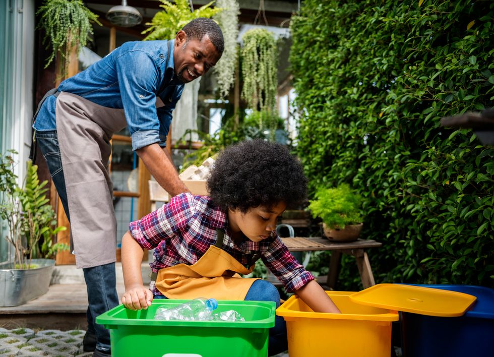 a child recycling plastic bottles
