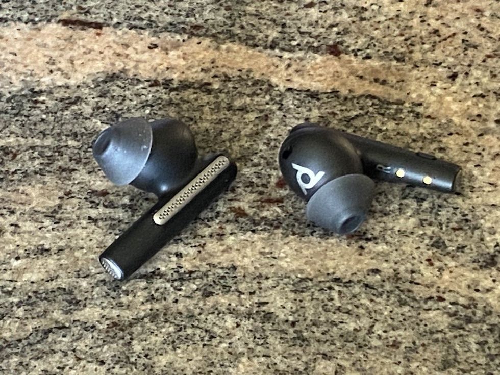 a close up photo of Voyager Free 60+ UC earbuds