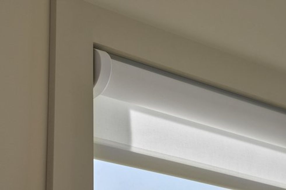 a closeup photo of Lutron Caseta smart roller shades