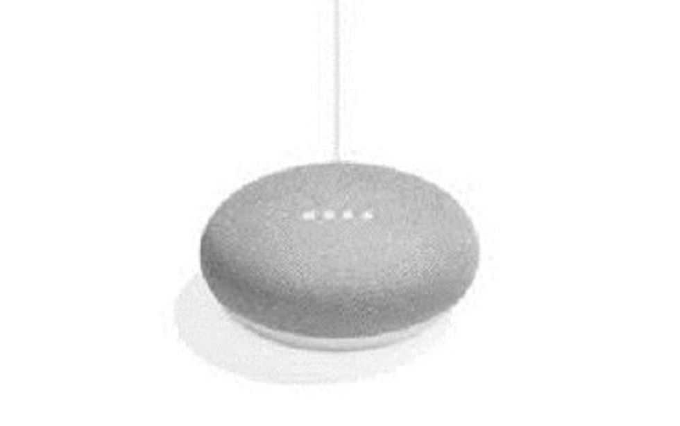 A Google home mini speaker, shaped like a pebble and covered with grey fabirc