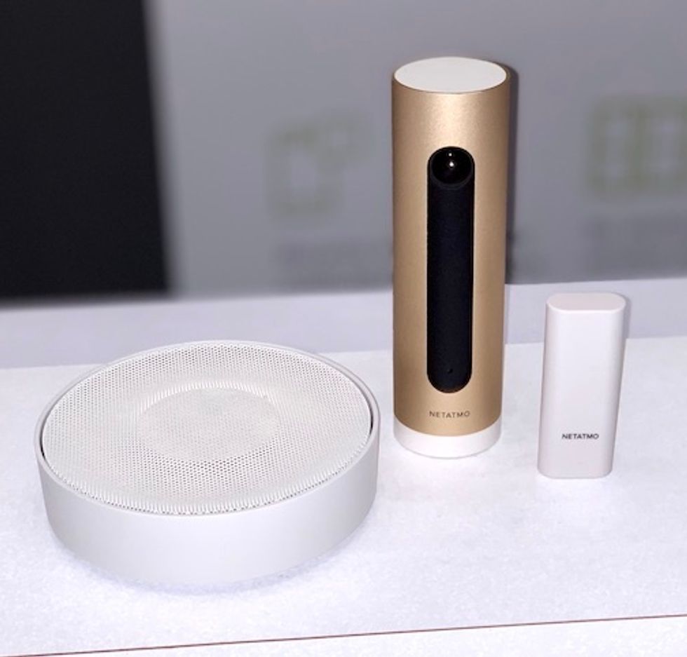 A large white siren, two tall devices one in white and one in gold