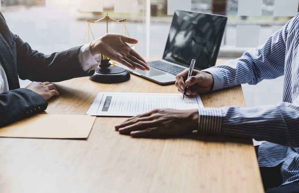 a lawyer speaking to her client.