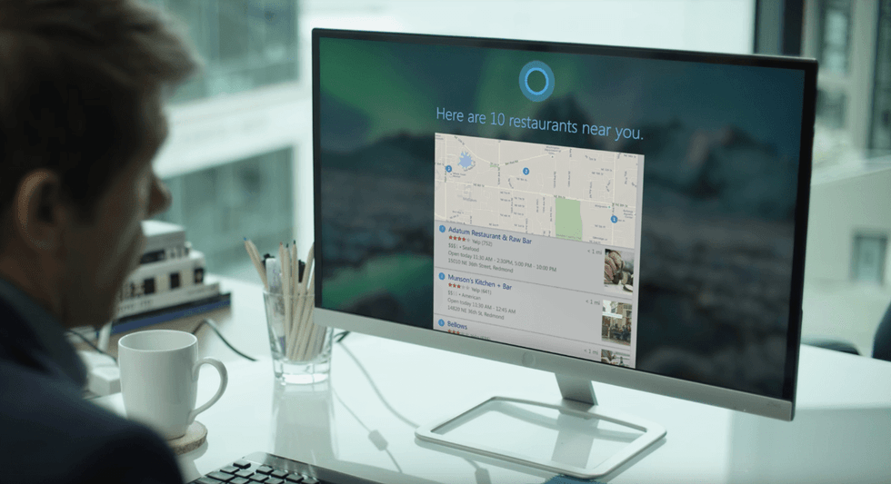a man on a computer looking at map