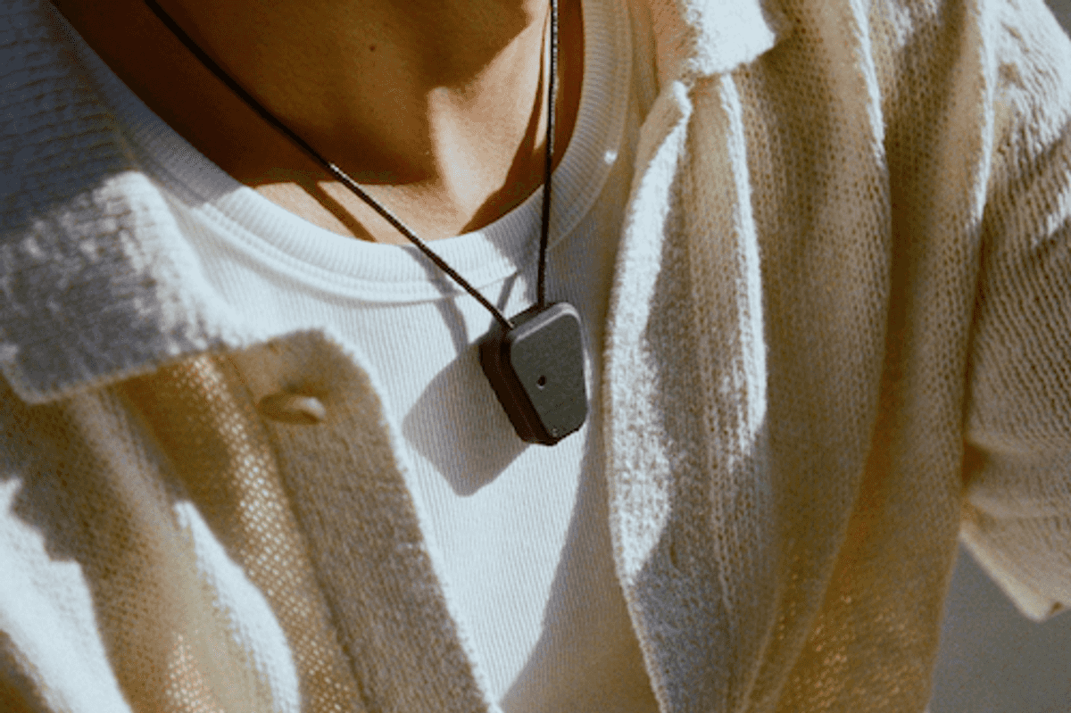 a man wearing Compass AI wearable