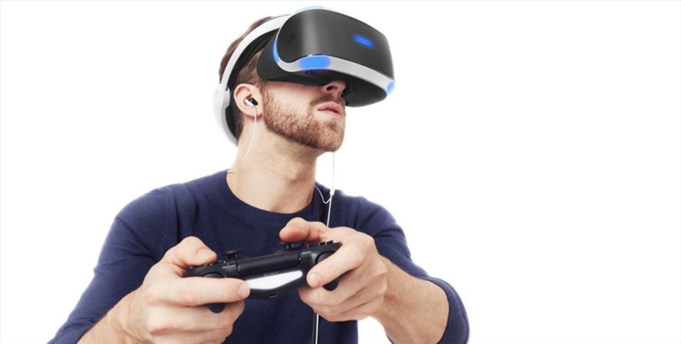 A man wearing sony playstation vr headset