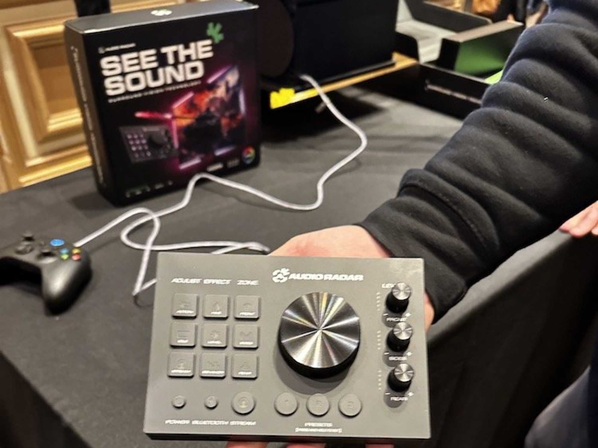 a person holding Audio Radar device at the CES Show 2024