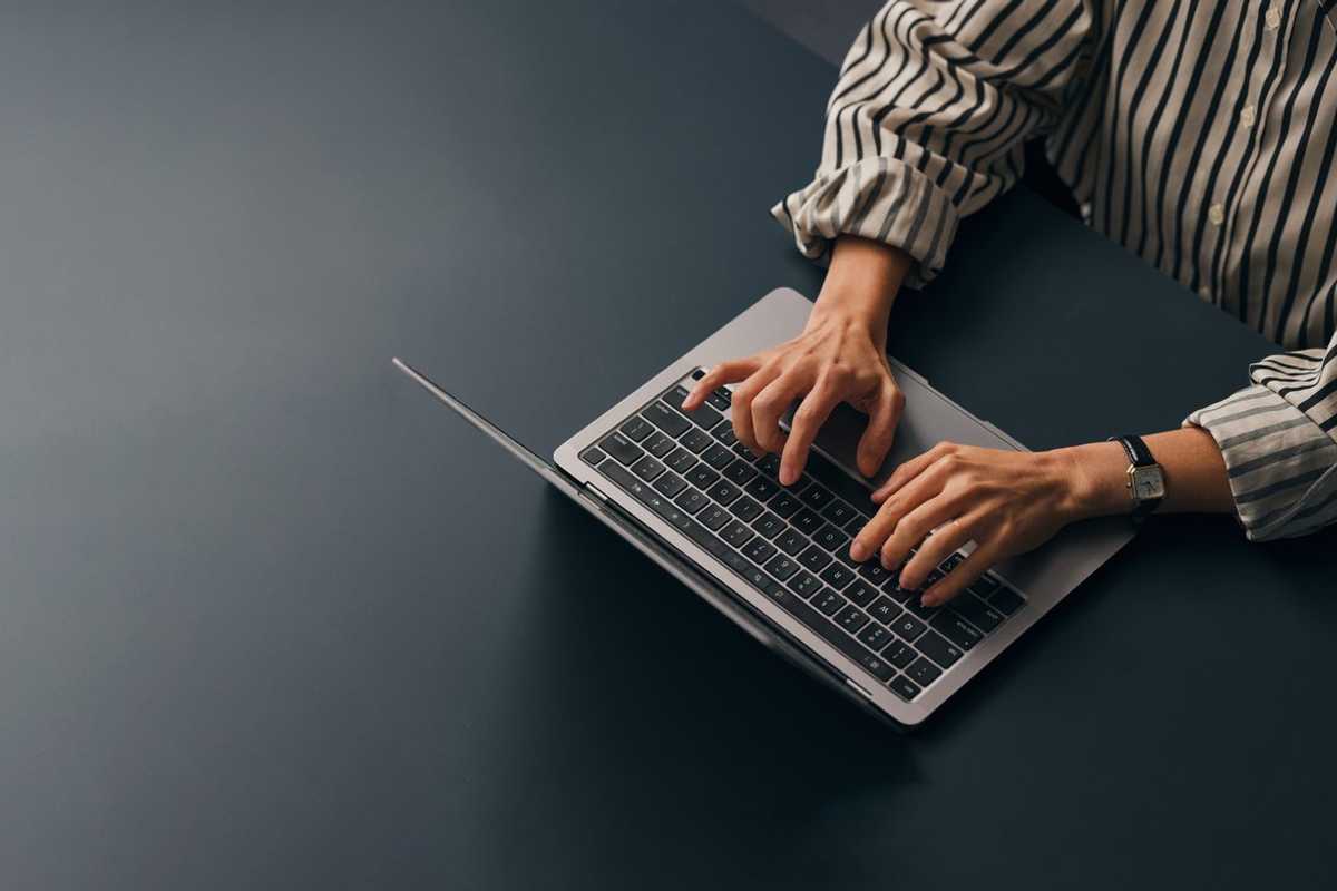 a person on a chromebook typing