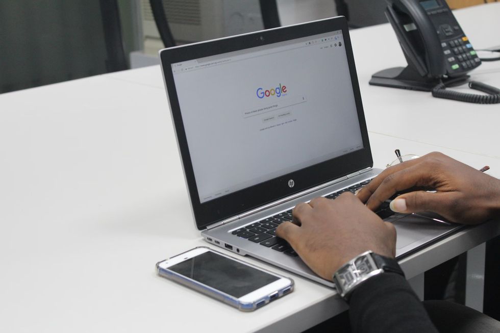 a person typing on a laptop