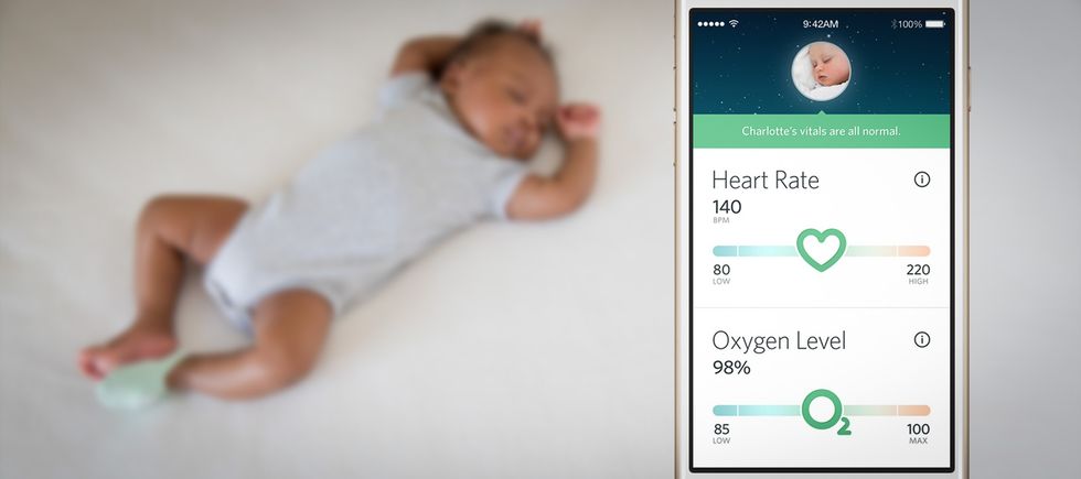 a photo of a baby sleeping and smartphone showing the Owlet app