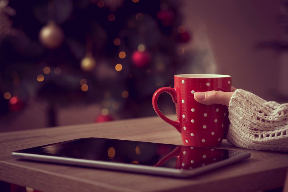 a photo of a coffee mug next to a tablet