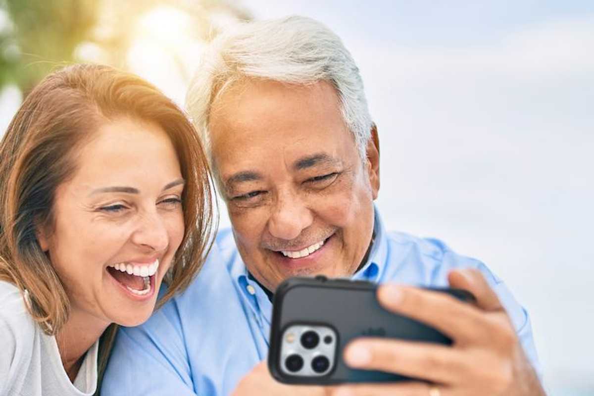 a photo of a couple with Catalyst Case on iPhone 14