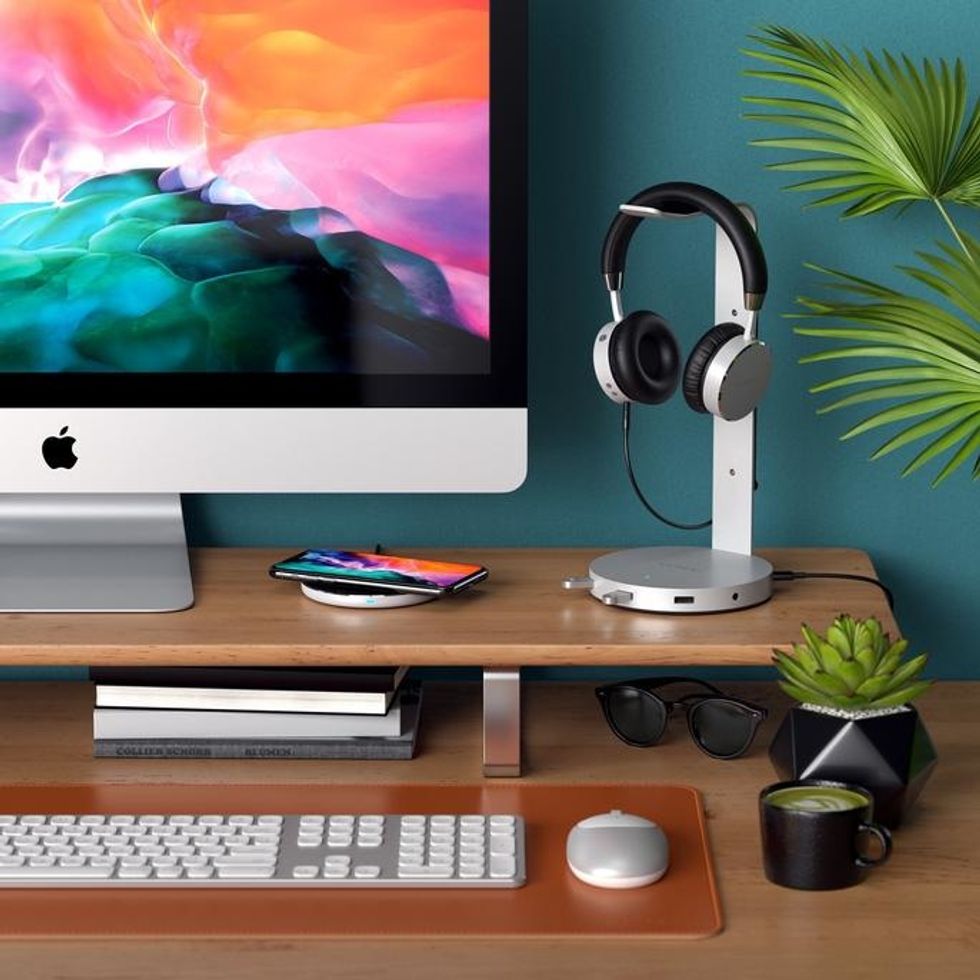 a photo of a desk with Satechi 2-in-1 Headphone Stand with Wireless Charger
