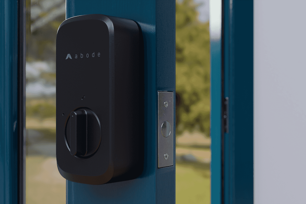 a photo of a door with Abode Retrofit Smart Lock install on it.