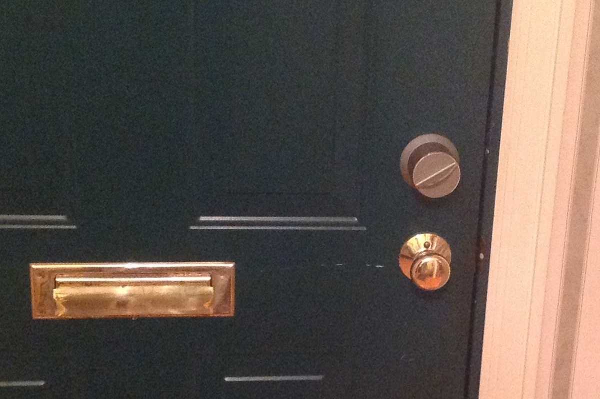 a photo of a door with Danalock V3 smart lock installed