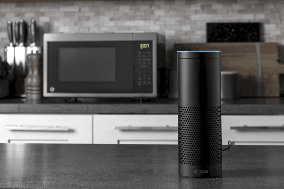 a photo of a echo speaker and ge smart appliance on a counter