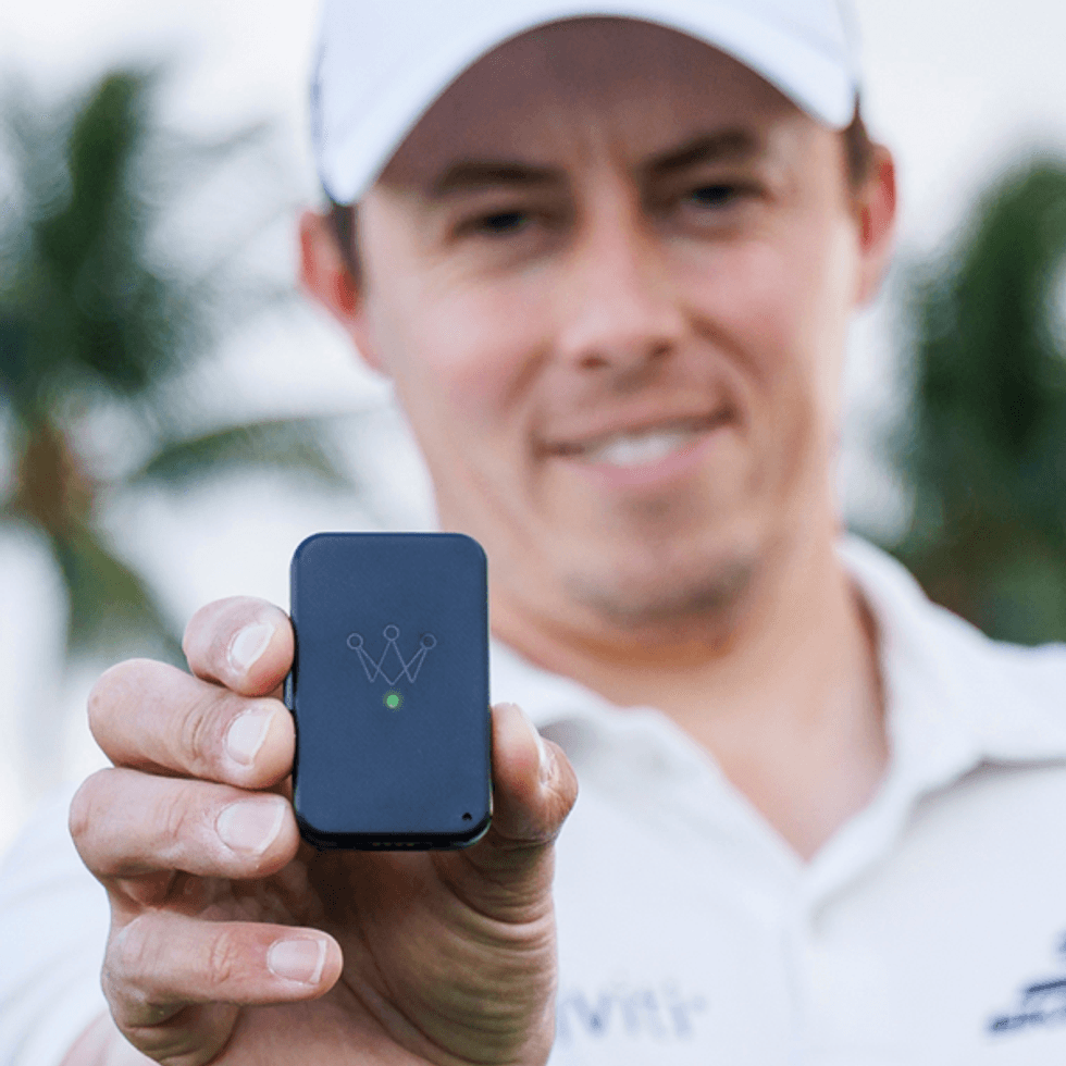 a photo of a golfer holding Arccos Air