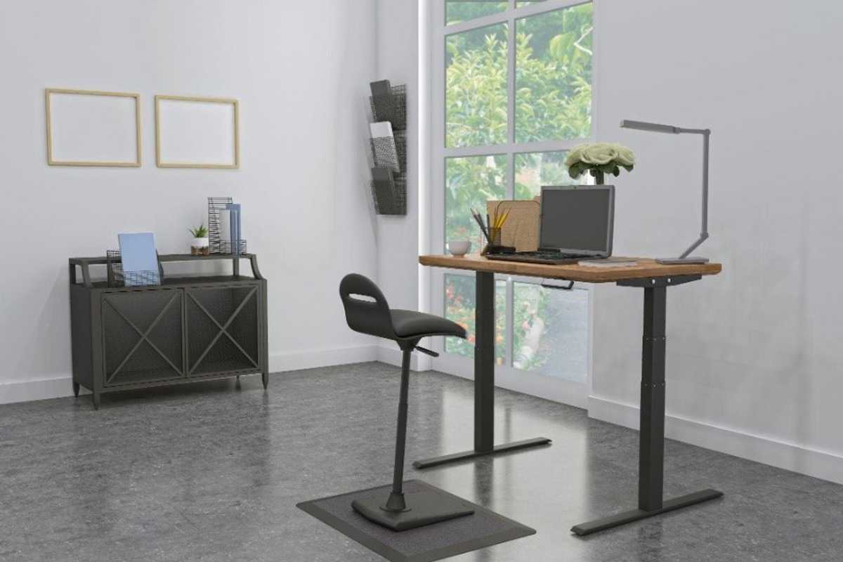 a photo of a home office with standing desk.