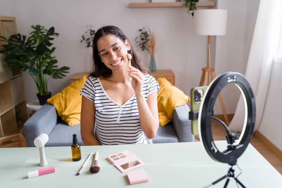 A photo of a influencer filming
