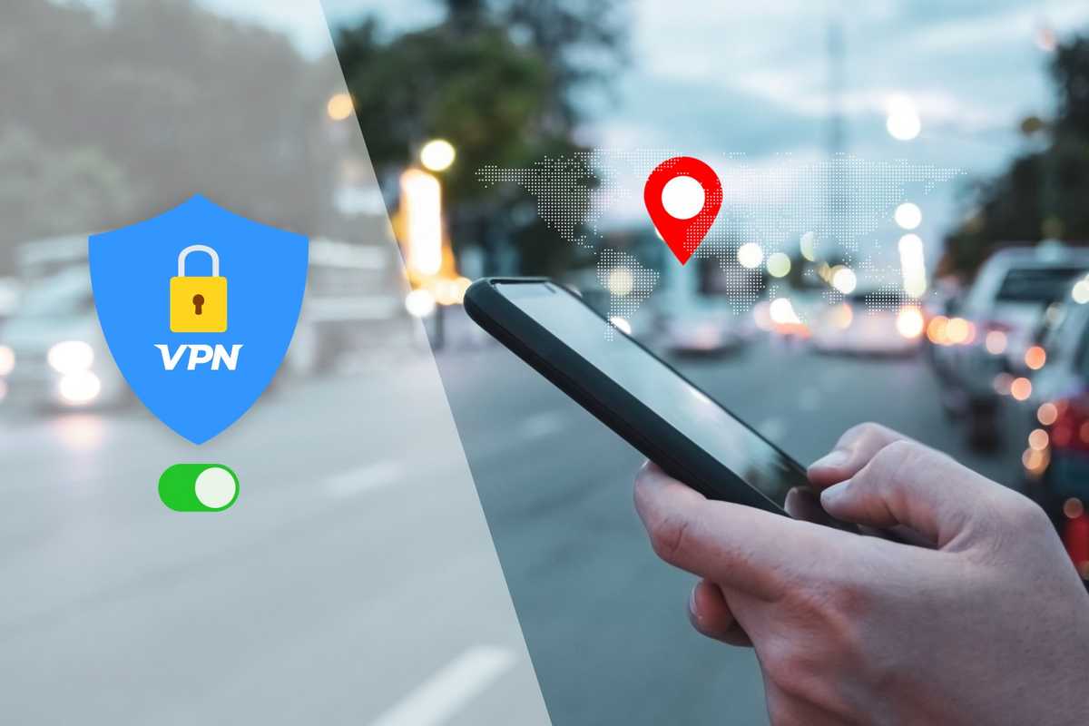 a photo of a iPhone in a person's hand standing on a street.