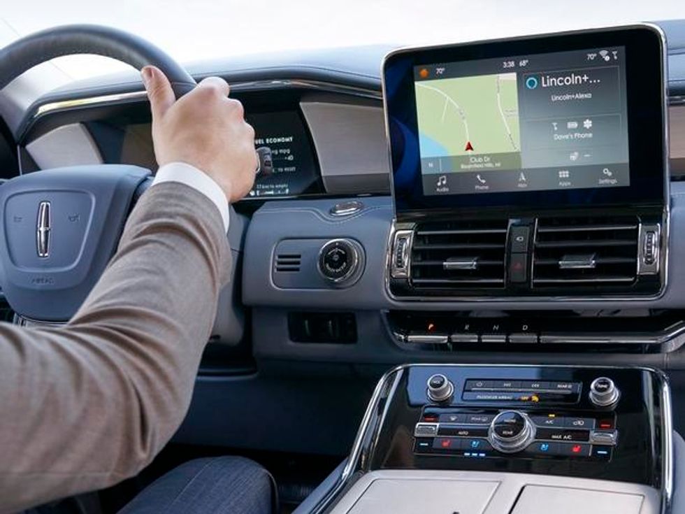 a photo of a Lincoln car with Alexa on the display