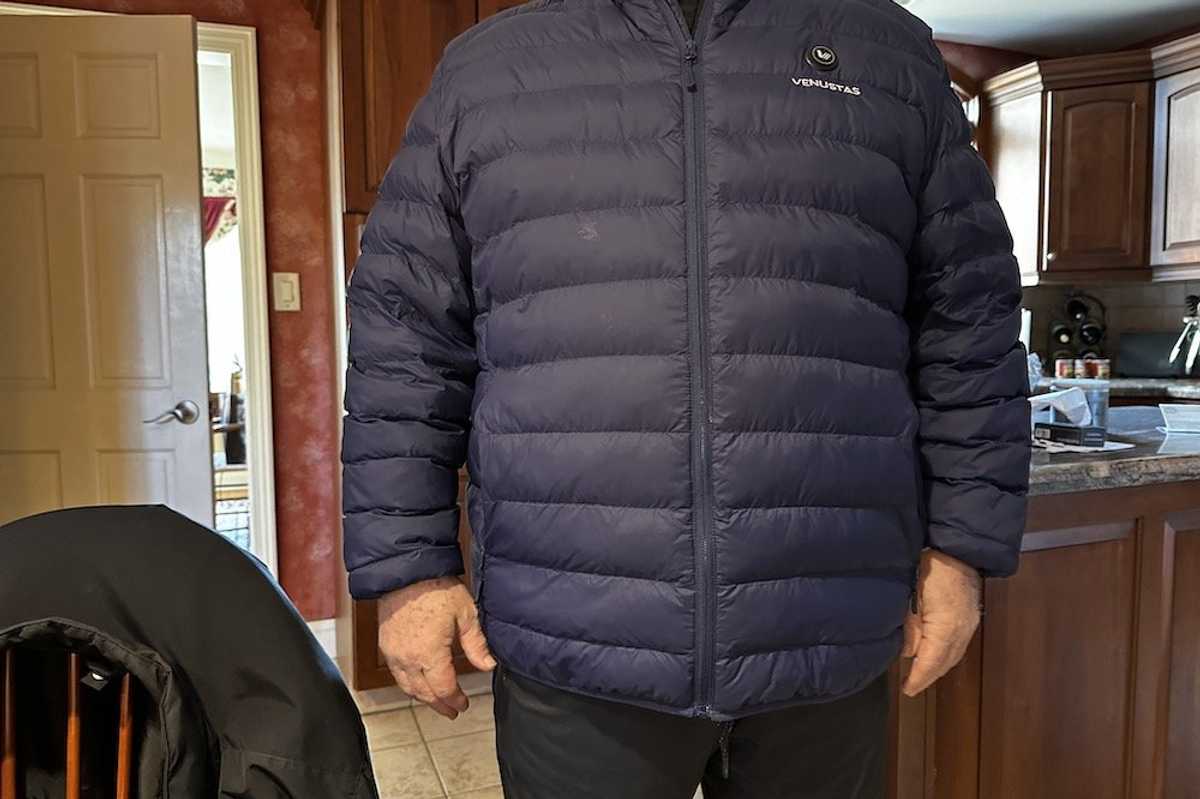 a photo of a male wearing a Venustas Men’s Heated Lightweight Puffer Jacket 7.4V