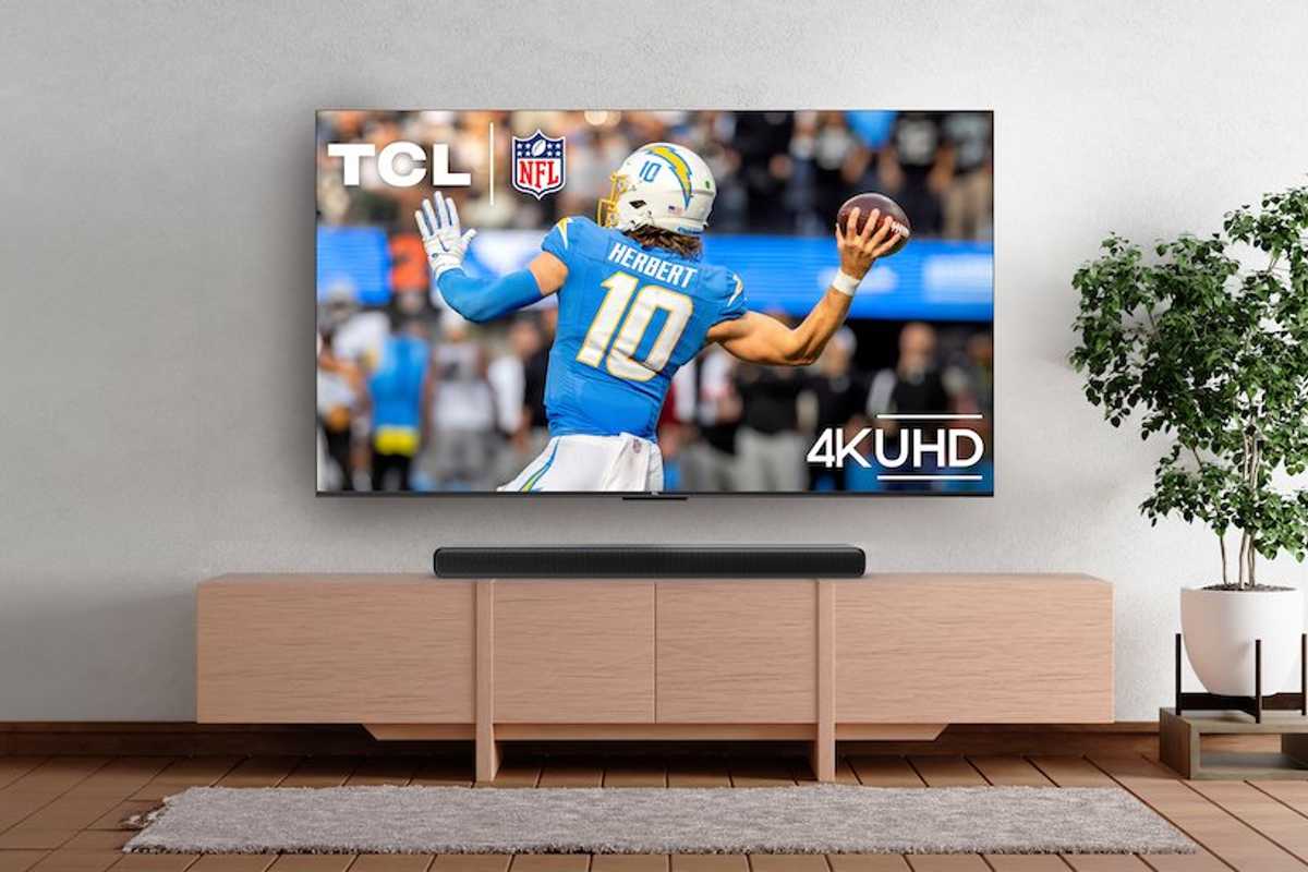 a photo of a New TCL soundbar in a living room