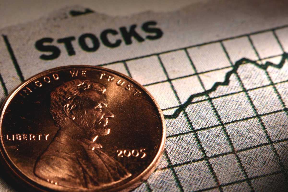 a photo of a penny on top of a stock sheet