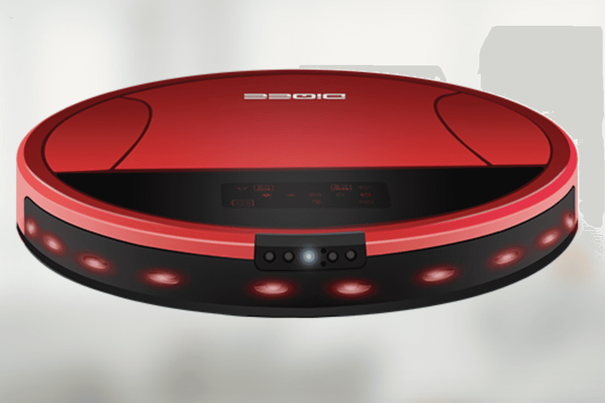 a photo of a robot vacuum suspended in the air