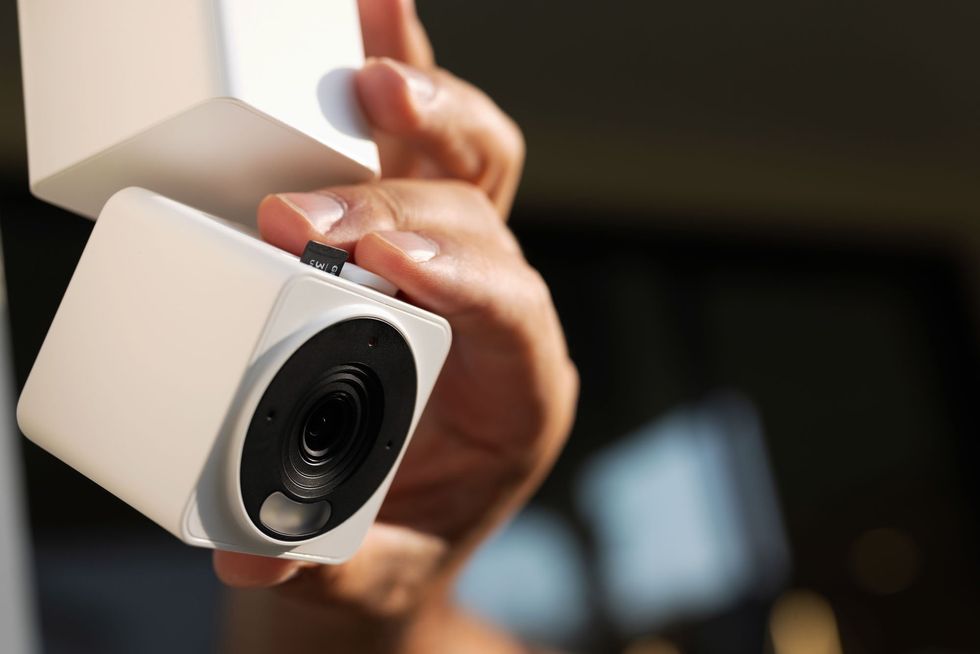 a photo of a SD Card being installed in a Wyze Cam Pan v4