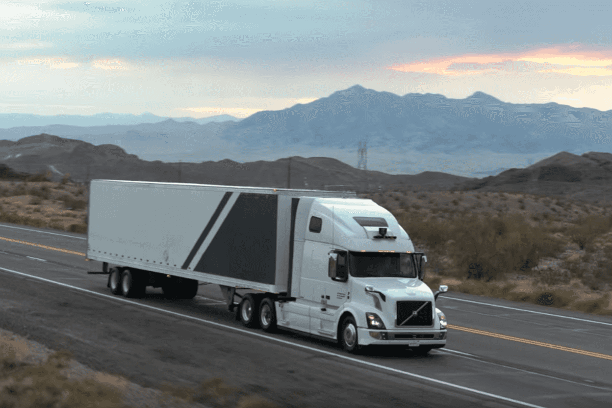 a photo of a self-driving truck driving on the road