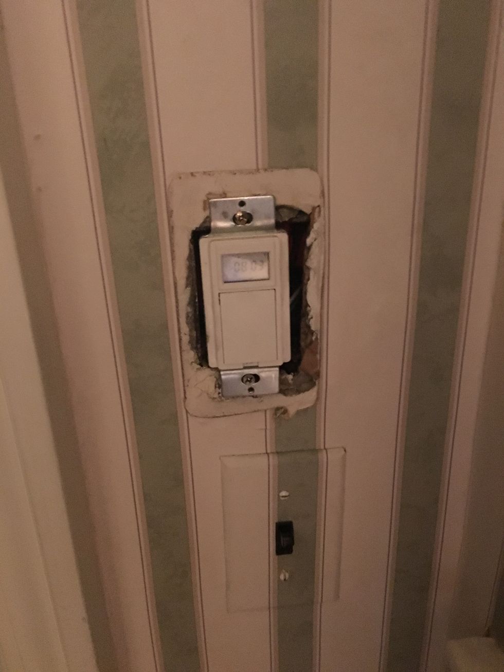 a photo of a smart light switch on the wall
