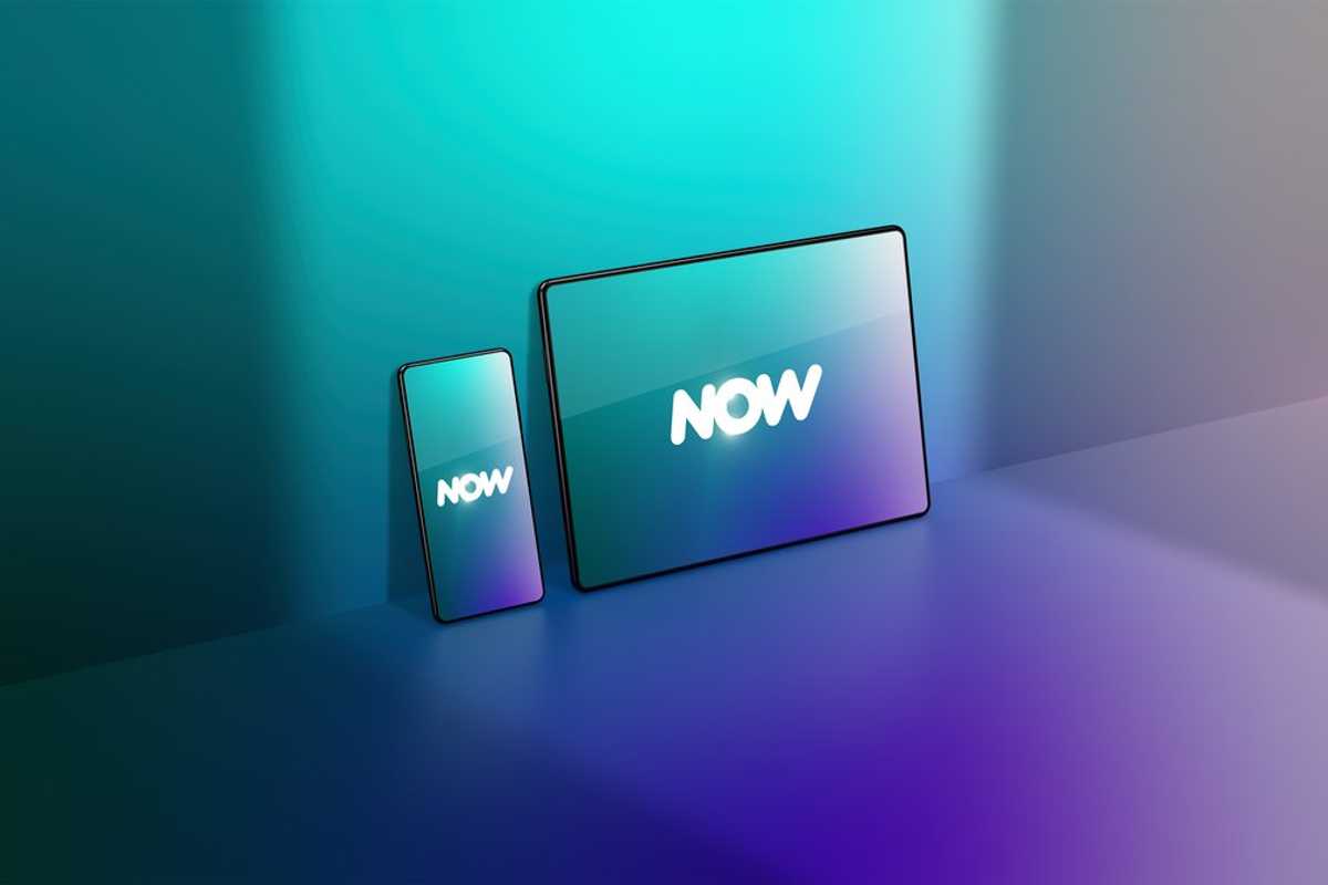 a photo of a smartphone and tablet with Comcast NOW logo on them