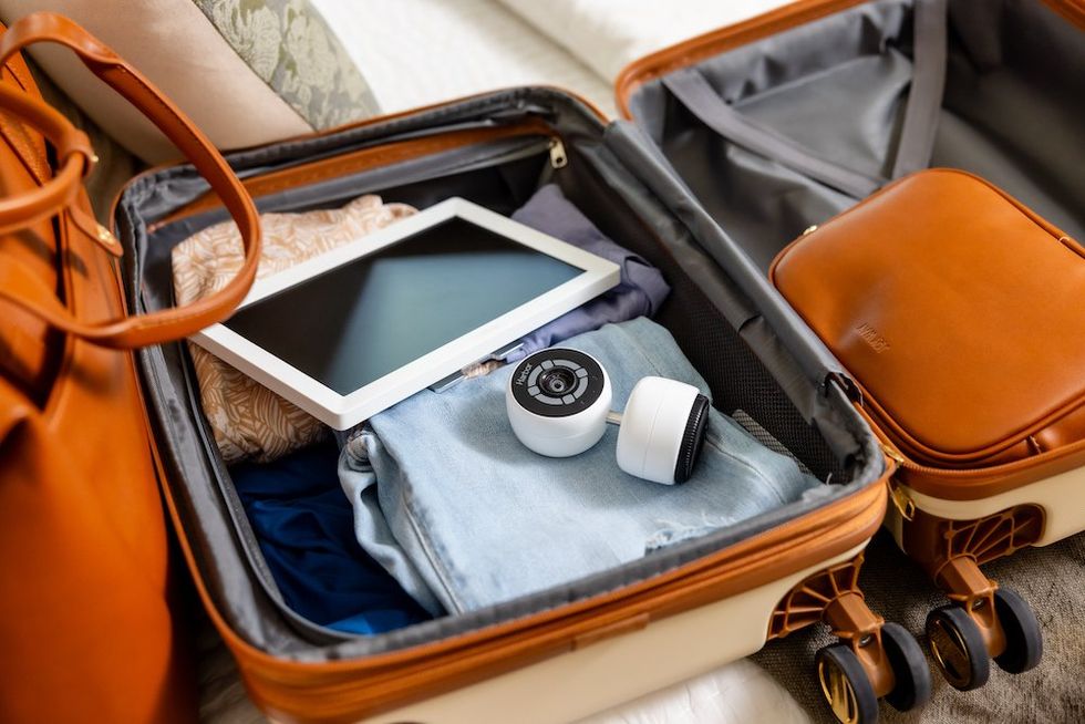 a photo of a suitcase with Harbor monitor and camera inside