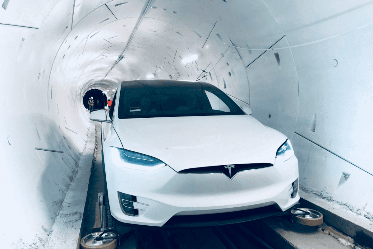 a photo of a Tesla in a boring tunnel