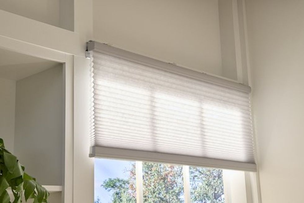 a photo of a window with new Lutron Caseta Smart honeycomb shades