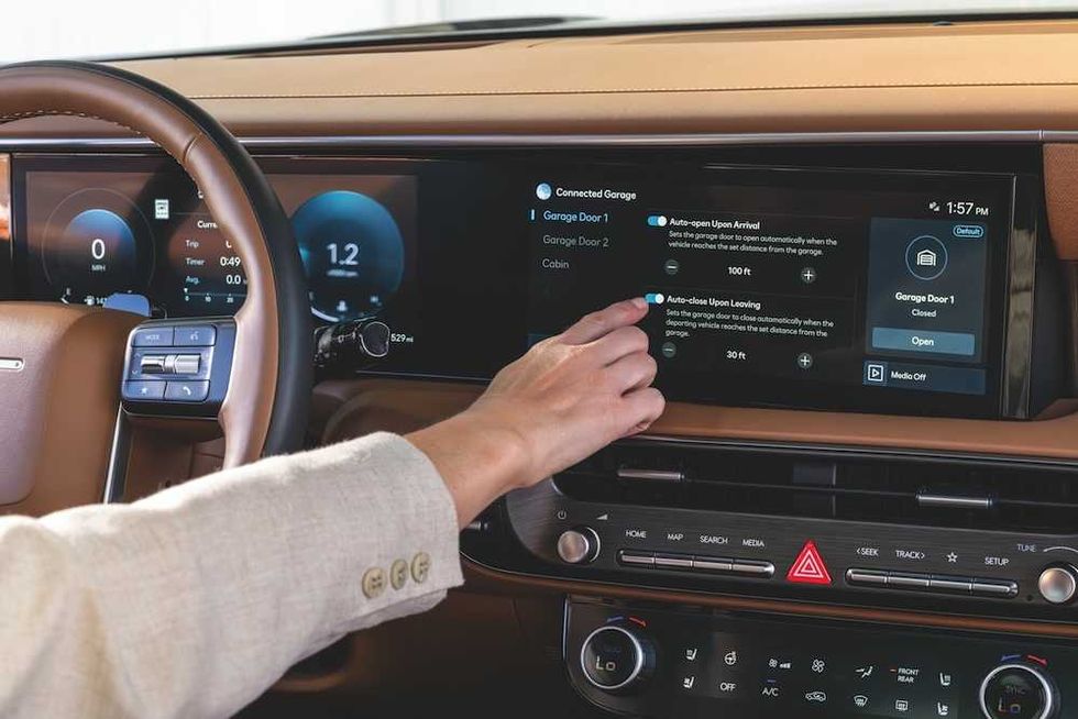 a photo of a woman activating Custom Geofencing using myQ integrated into her Hyundai