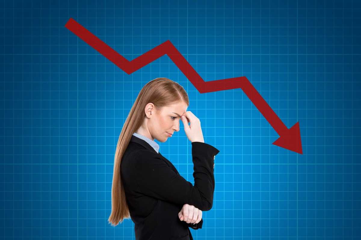 a photo of a woman investor worried about her stocks declining