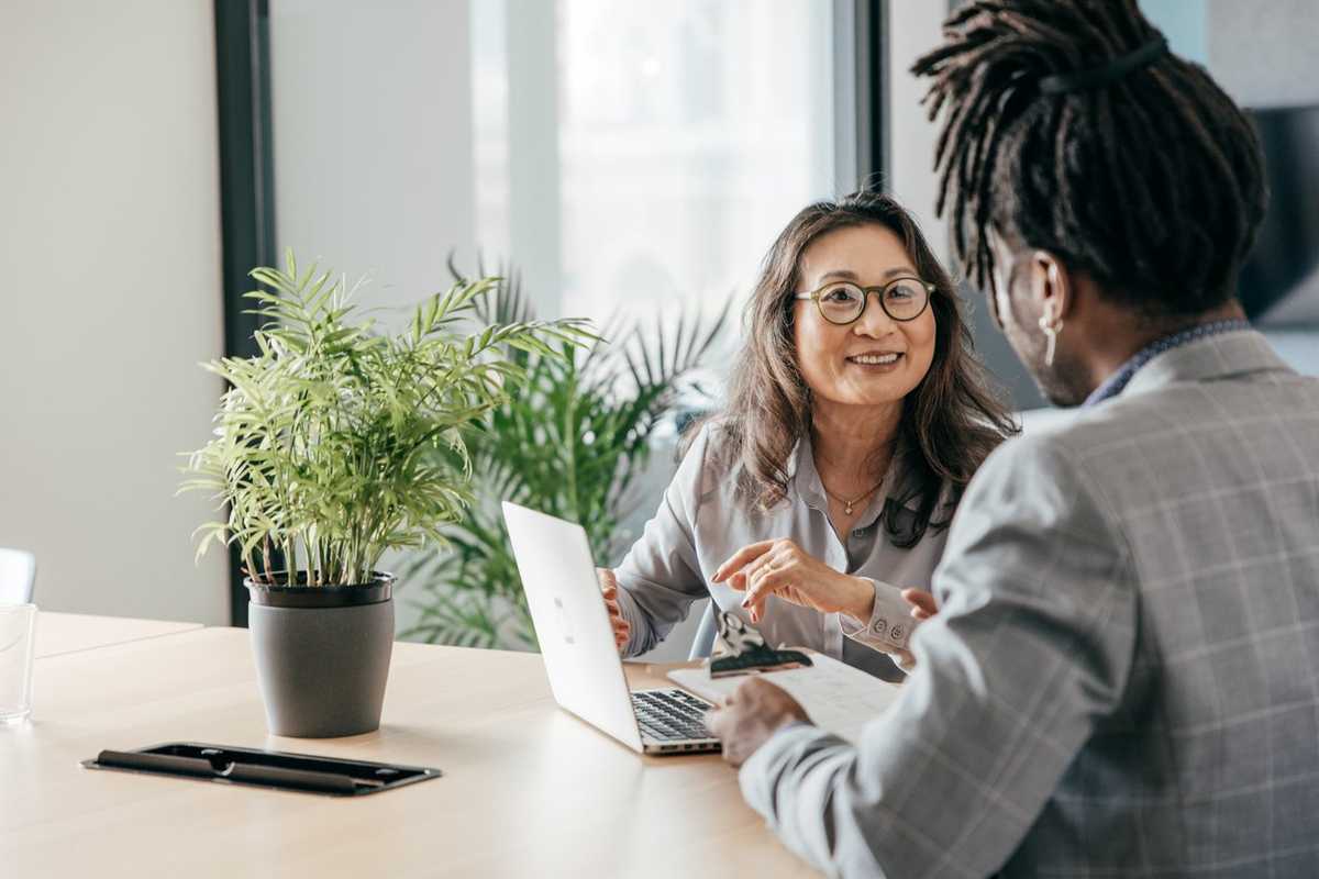 a photo of a woman tutoring another woman