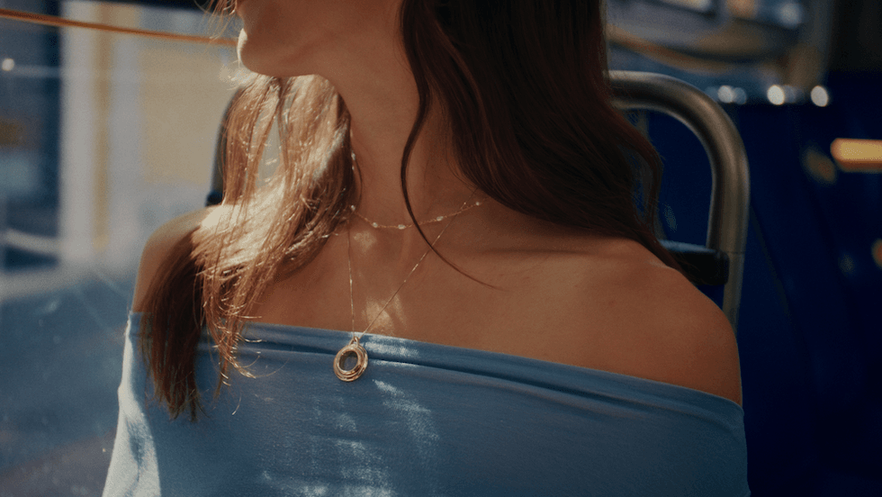 a photo of a woman wearing Taya Necklace