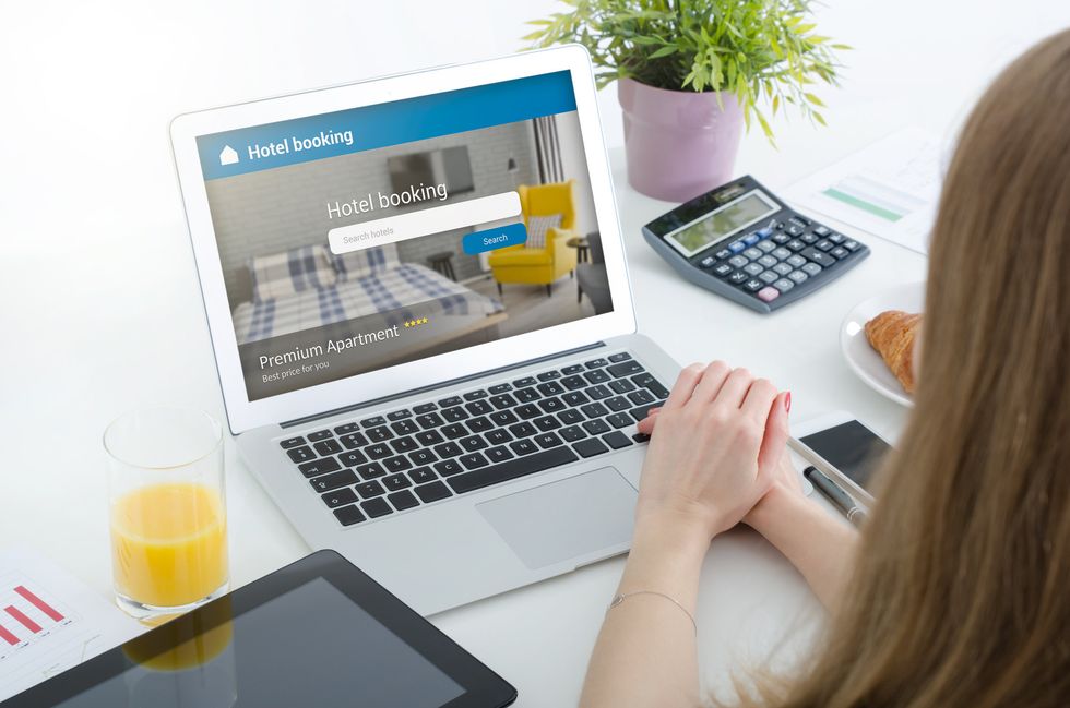 a photo of a woman working on her laptop