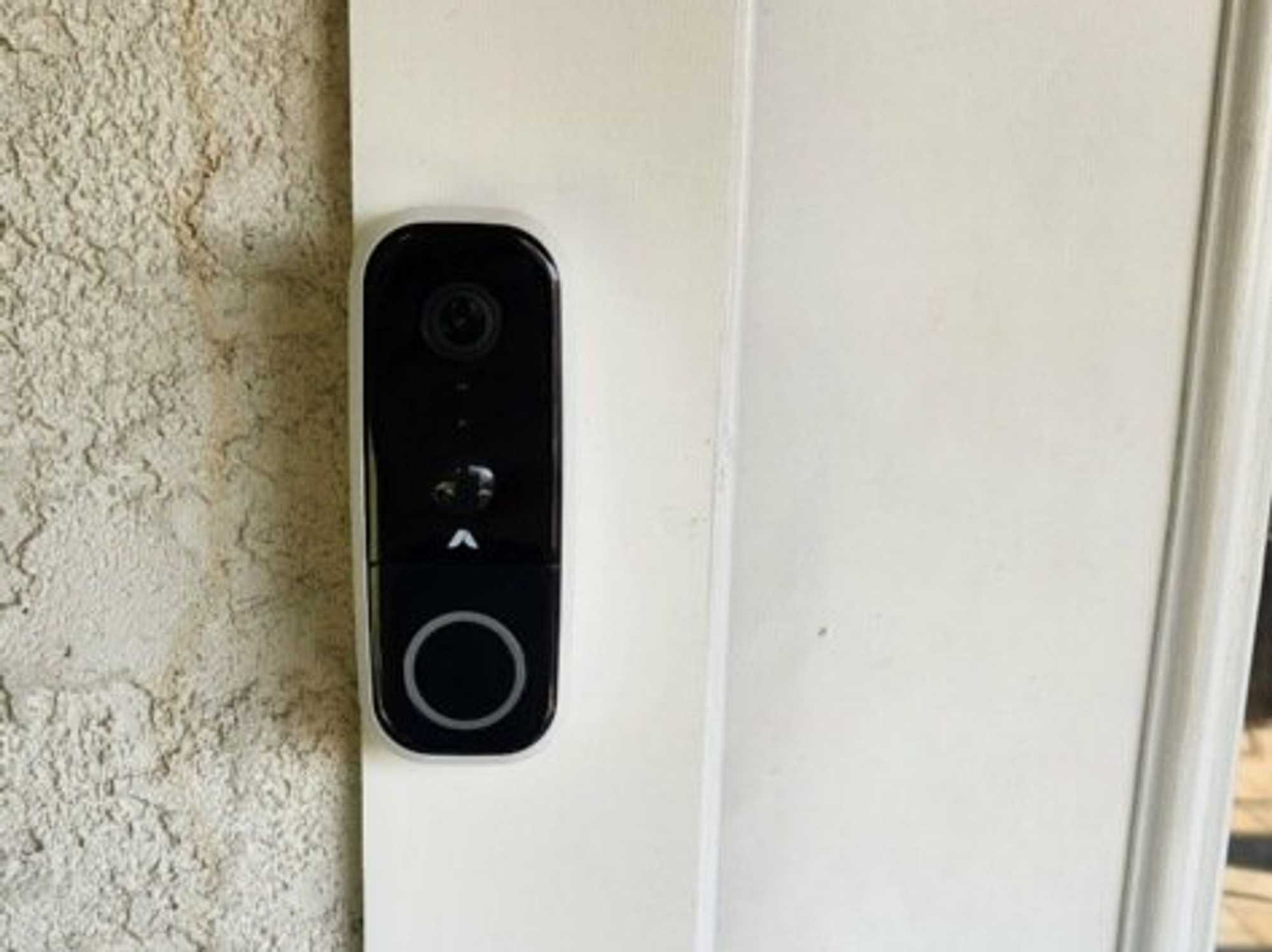 a photo of Abode Wireless Video Doorbell installed on a door