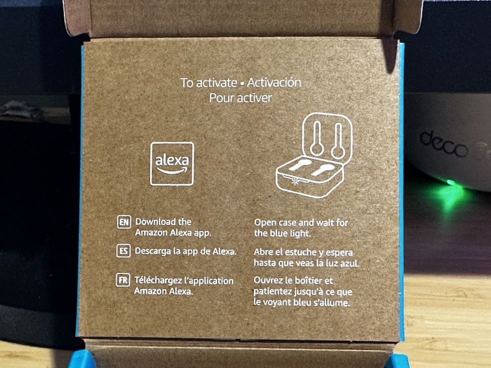 a photo of Amazon Echo Buds (2023 Release) box with instructions showing