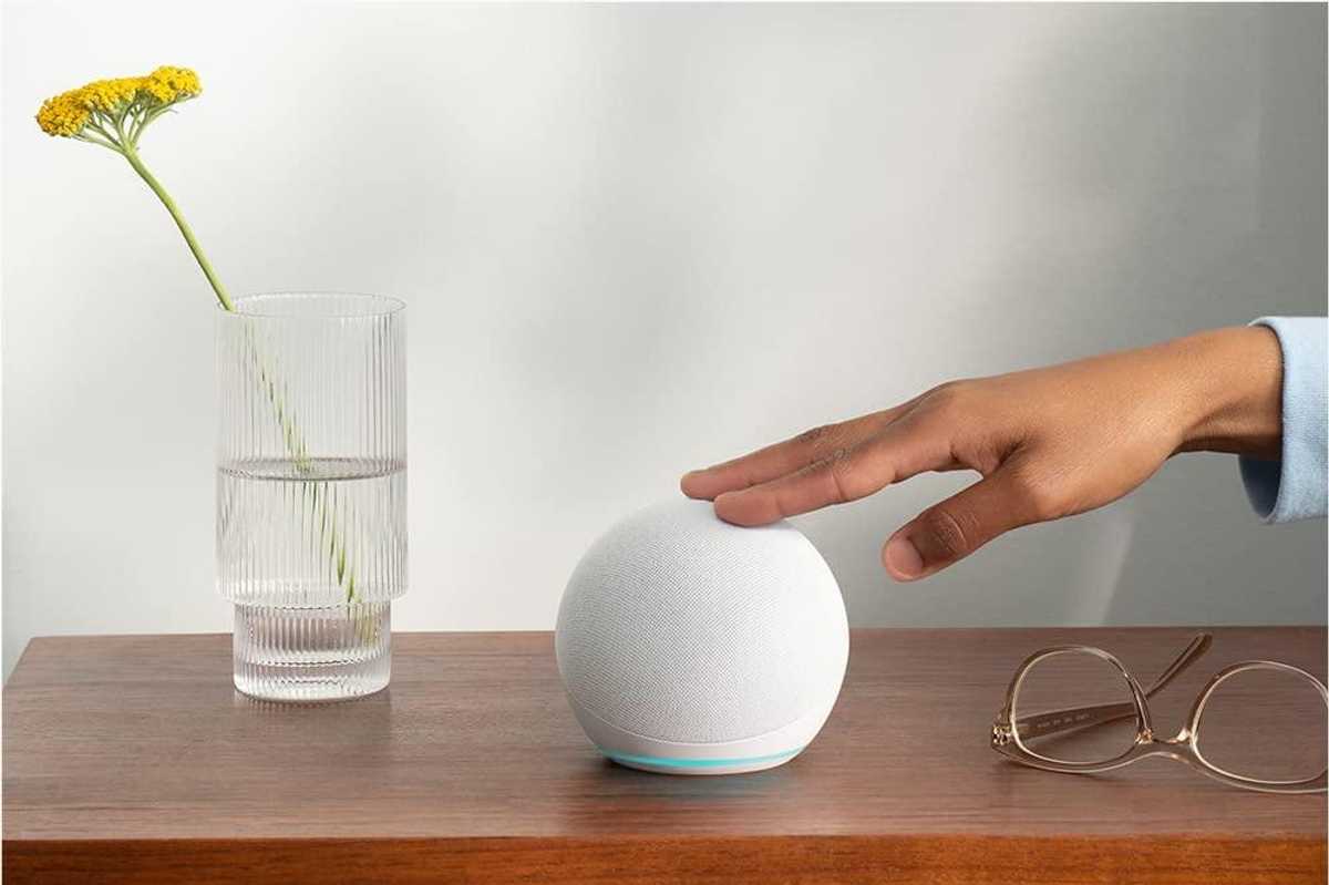 a photo of amazon echo dot 5th gen on an nightstand