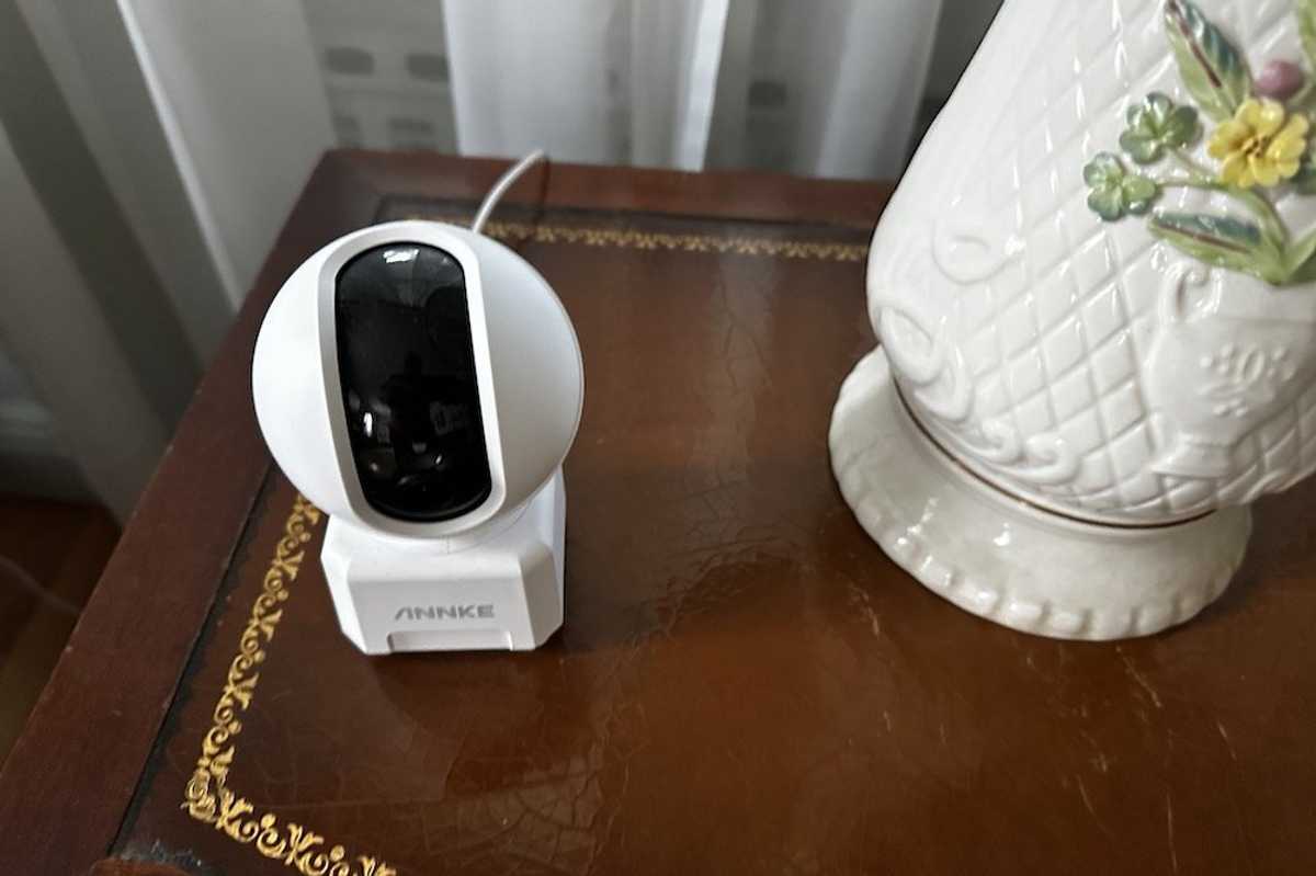 a photo of Annke Crater Pro Dual-Band WiFi Indoor Camera on an end table