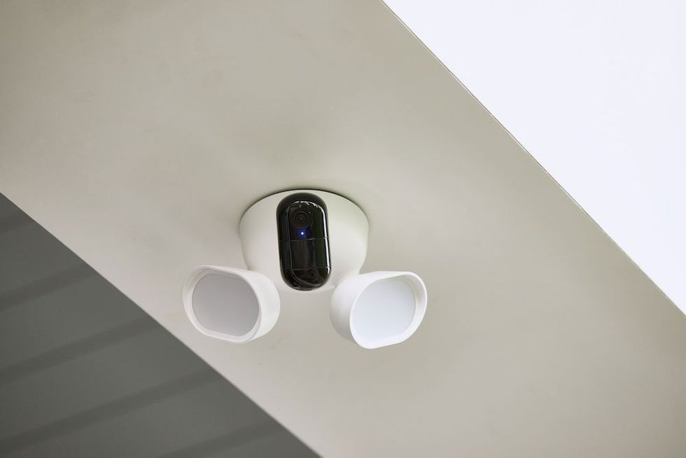 a photo of Arlo Wired Floodlight Camera installed on the ceiling