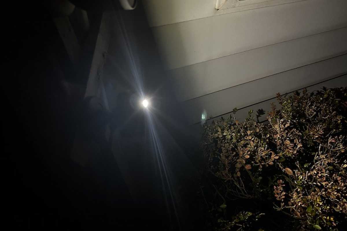 a photo of Blink Mini 2 Camera outside with LED on