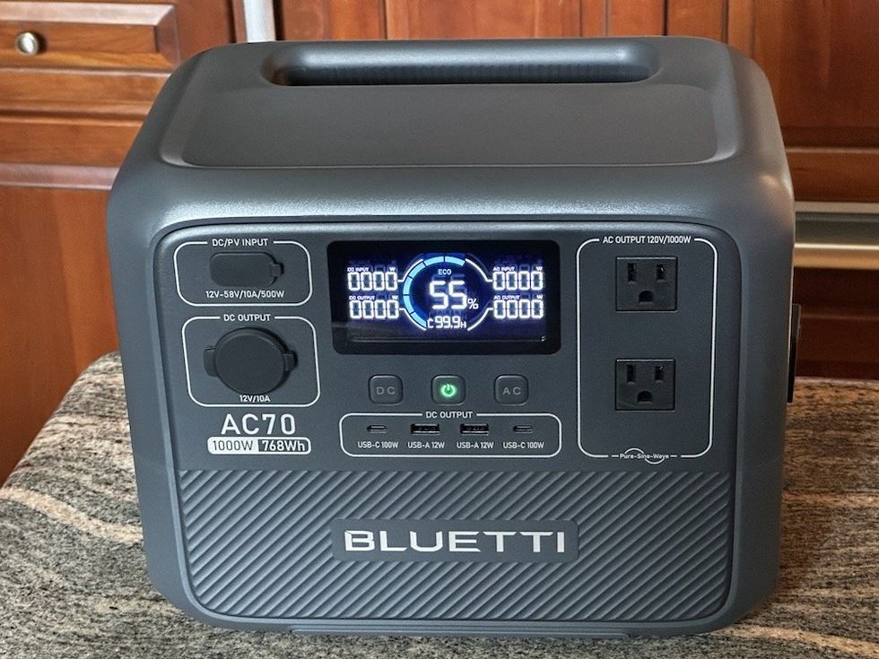 a photo of Bluetti AC70 on a counter powered on.