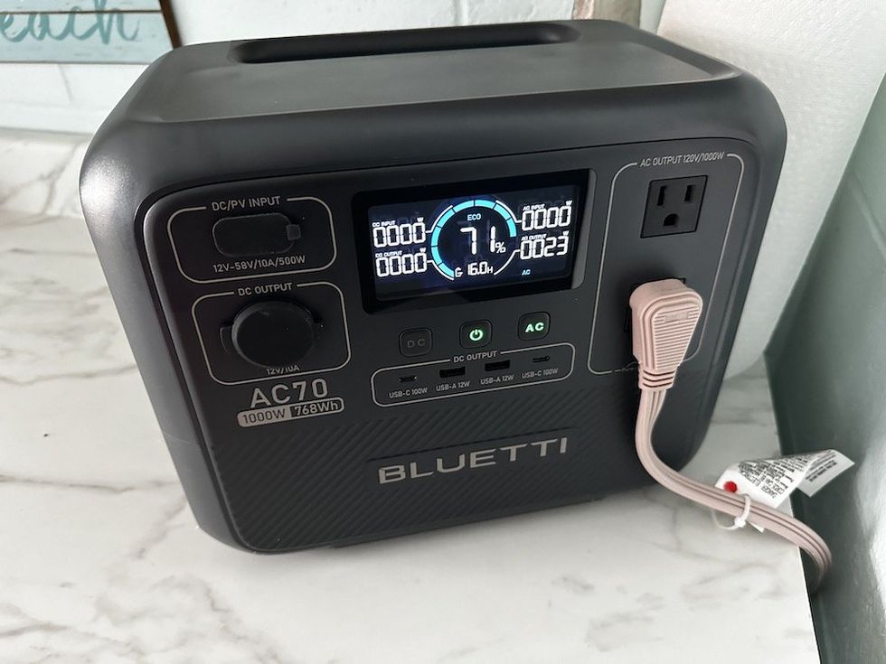 a photo of Bluetti AC70 powering a refrigerator