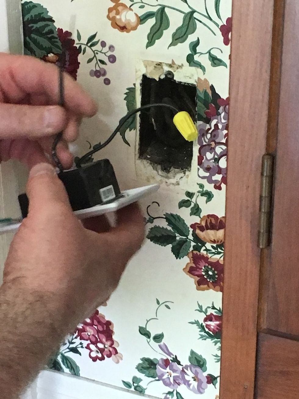 a photo of connecting wires onto a lutron caseta smart switch