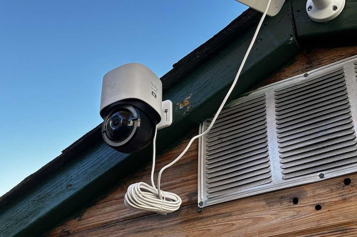 a photo of Eufy 4G LTE Cam S330 on a shed connected to a solar panel for power
